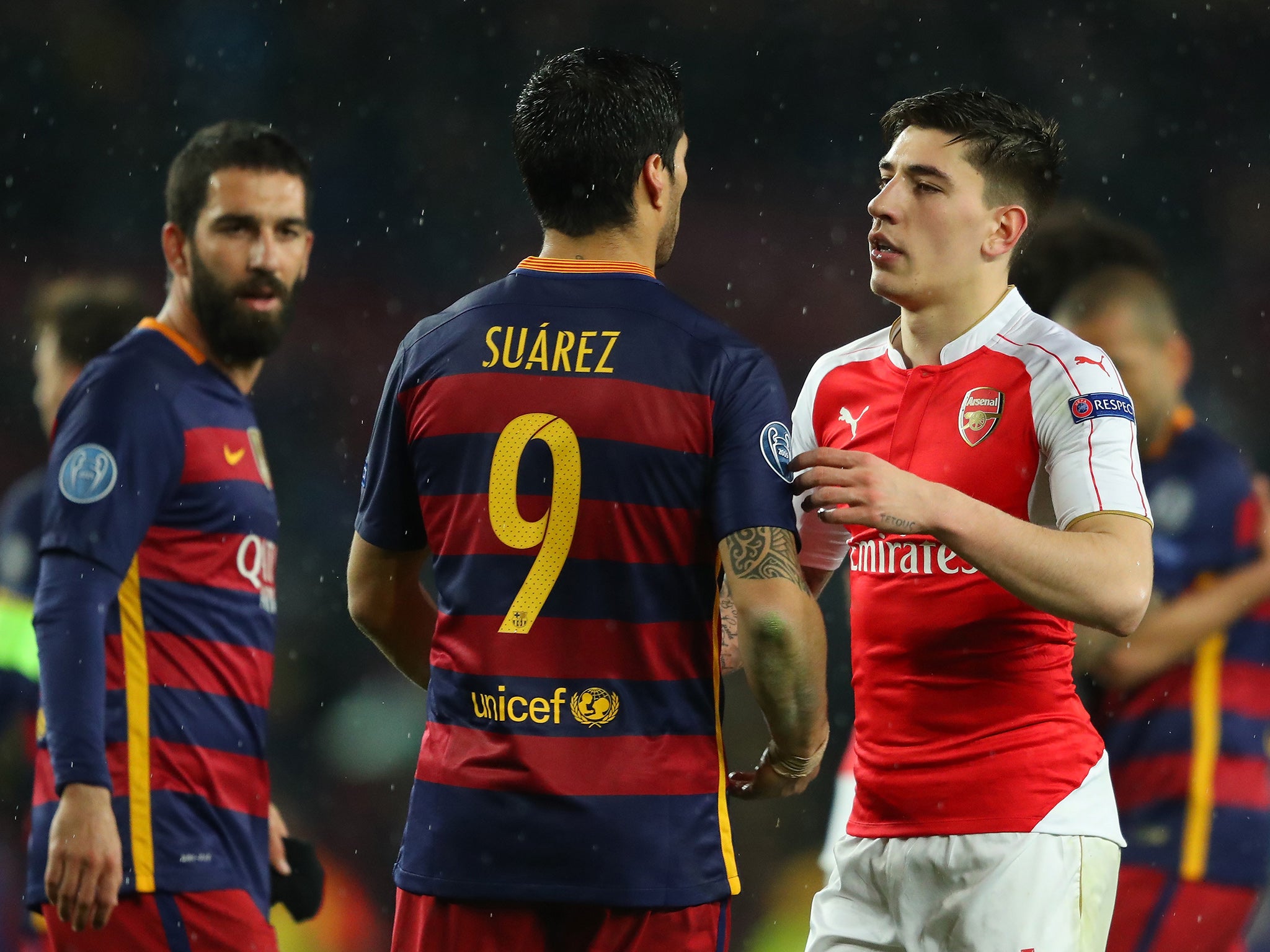 Luis Suarez greets Hector Bellerin at the final whistle