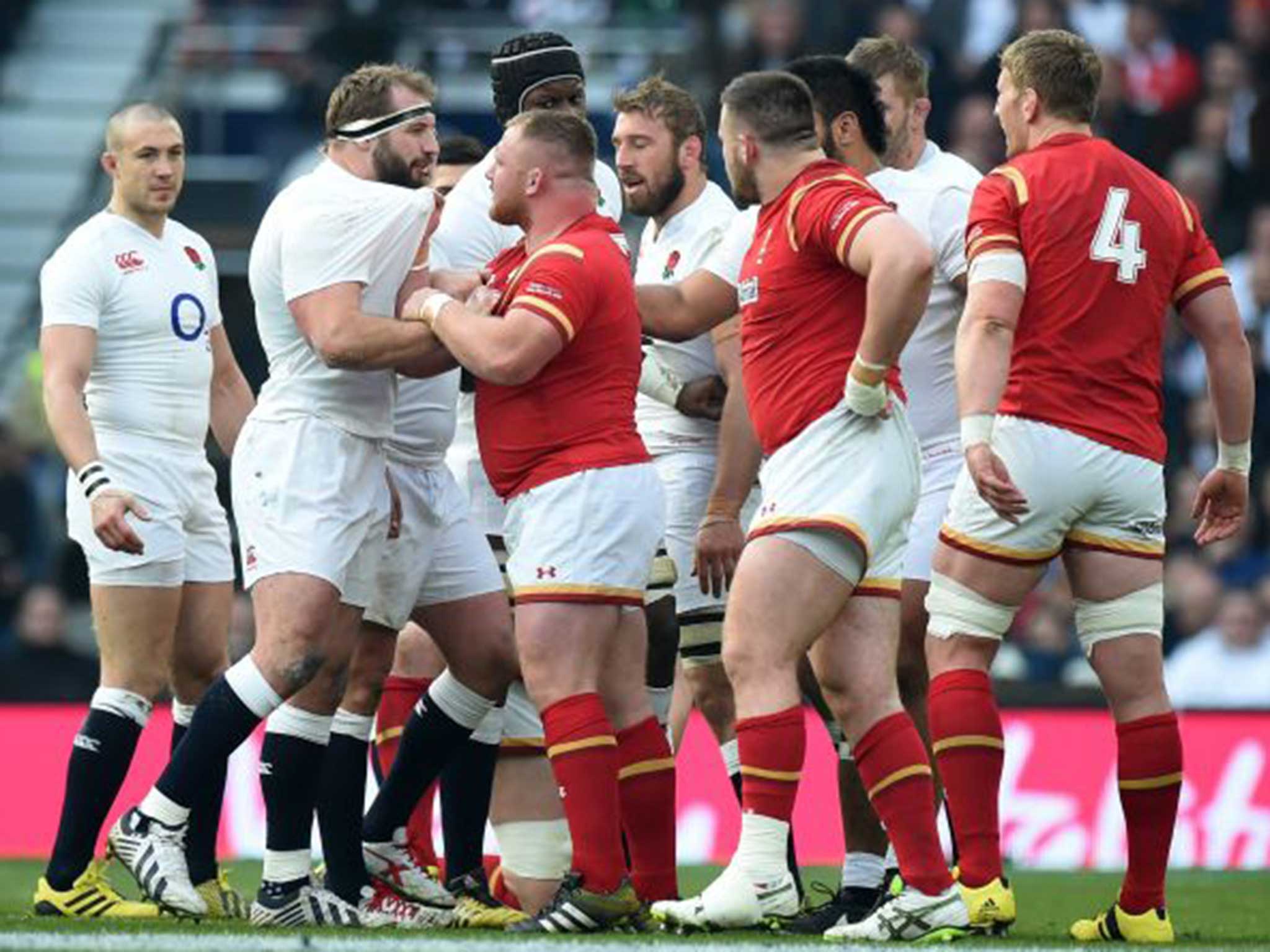 England's Joe Marler (2-L) scuffles with Wales' Samson Lee during the Six Nations rugby match at Twickenham