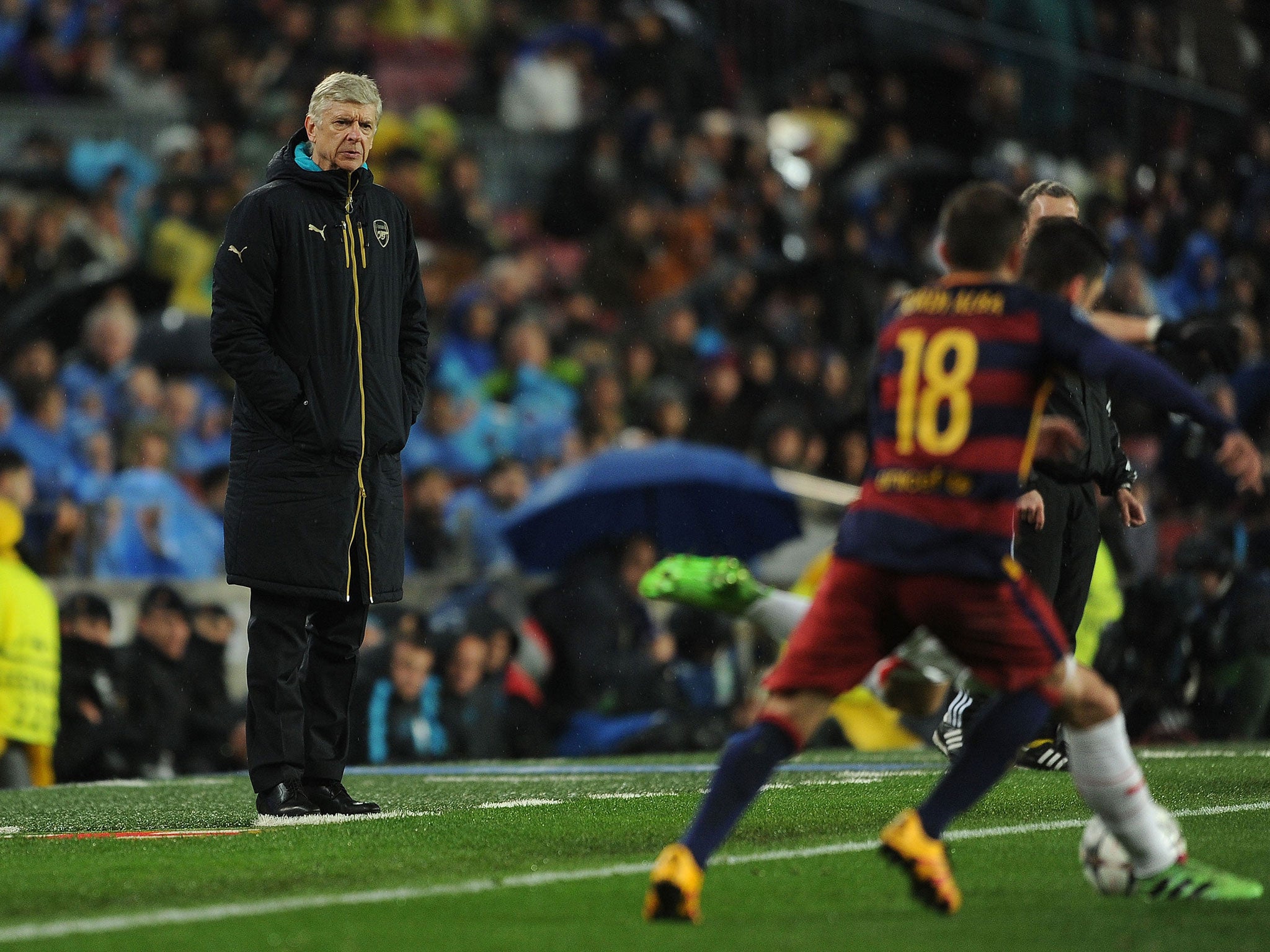 Arsene Wenger watches from the sidelines