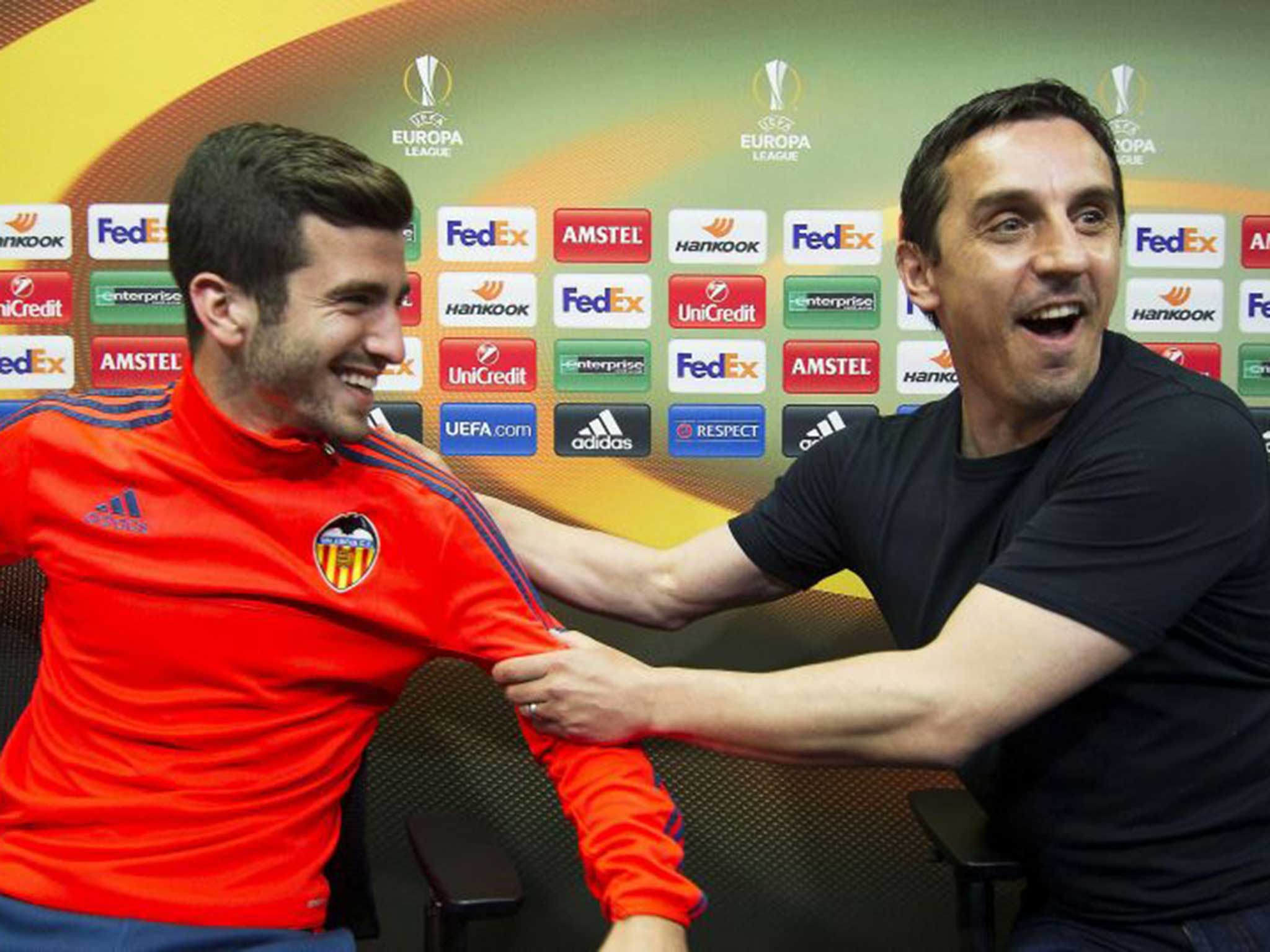 Valencia's English head coach Gary Neville (R) and Jose Luis Gaya