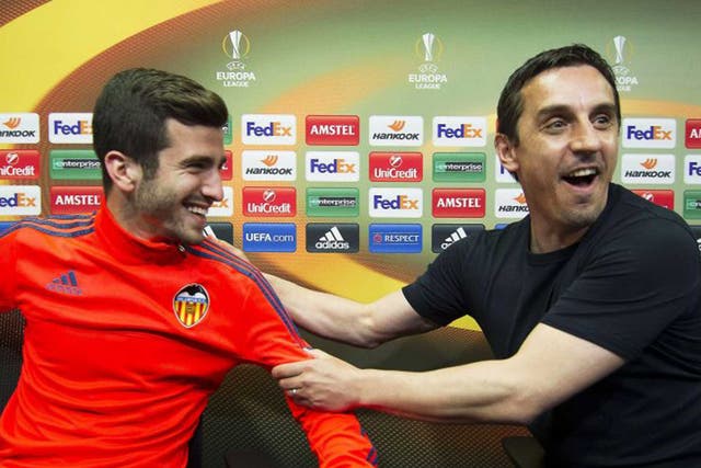 Valencia's English head coach Gary Neville (R) and Jose Luis Gaya