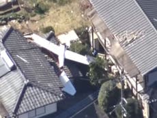 Two dead as glider crashes on to roof of house