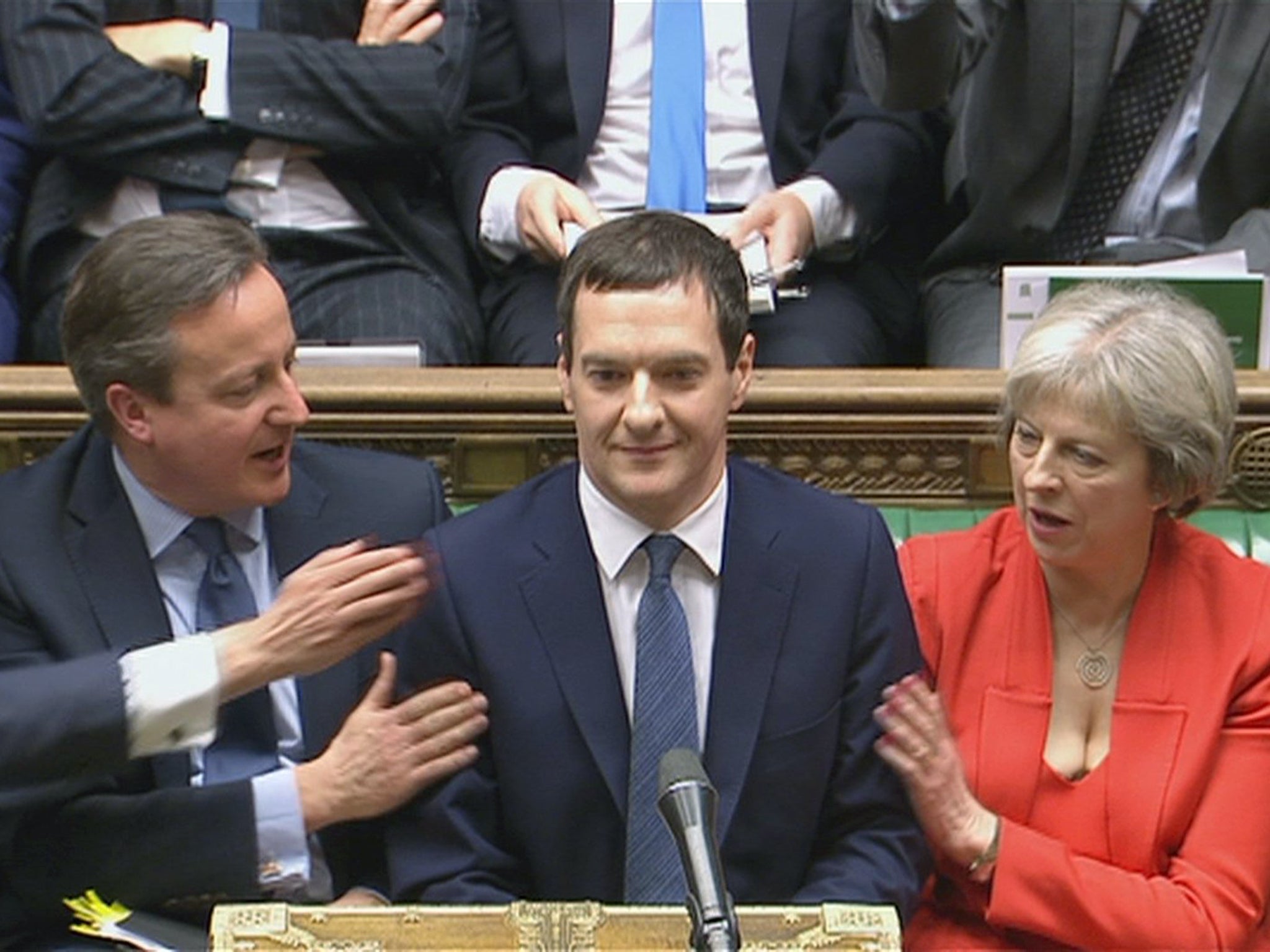Britain's Chancellor of the Exchequer George Osborne takes his seat after delivering his Budget to the House of Commons