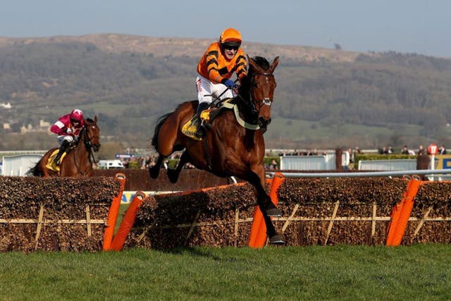 Thistlecrack leaps over the final hurdle on his way to victory in the World Hurdle