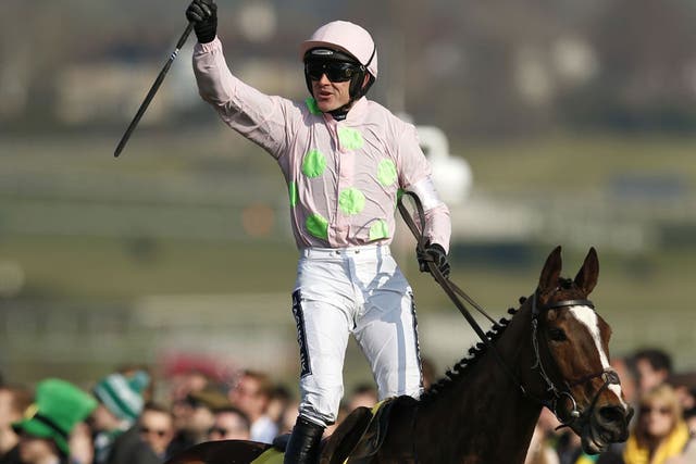 Ruby Walsh celebrates after riding Vautour to victory in the Ryanair Chase
