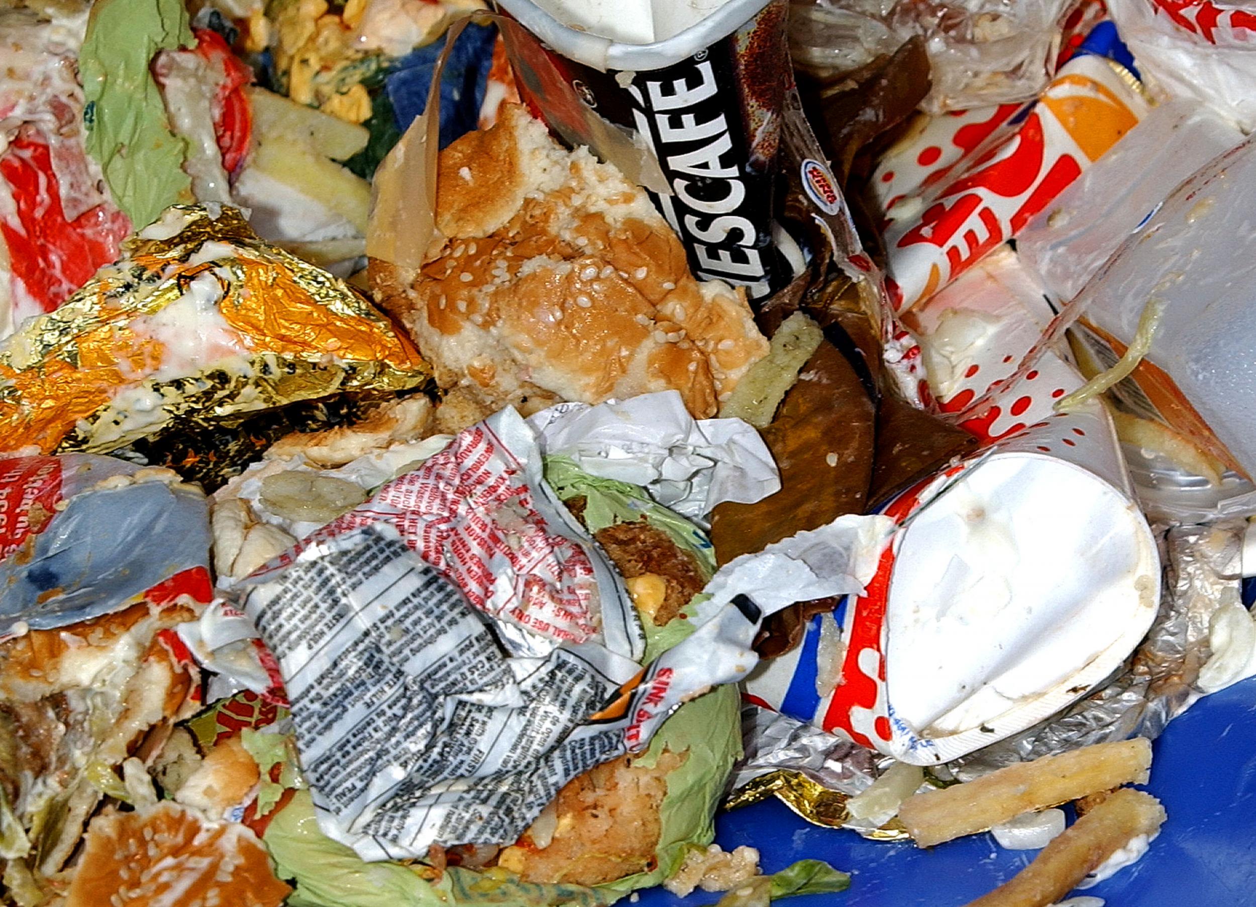 A bin overflows with food waste in central London