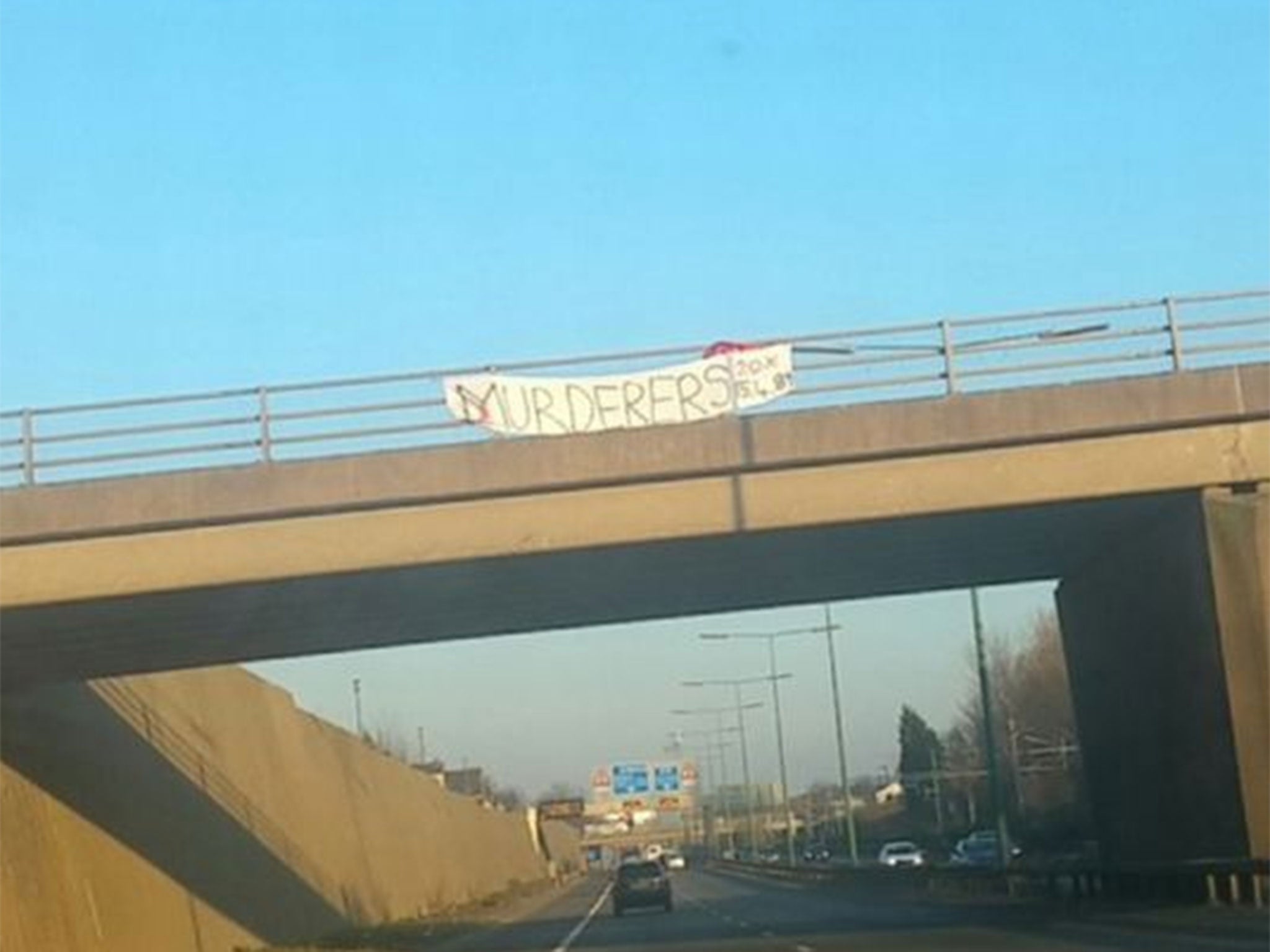 The 'MURDERERS' banner hung over the M602