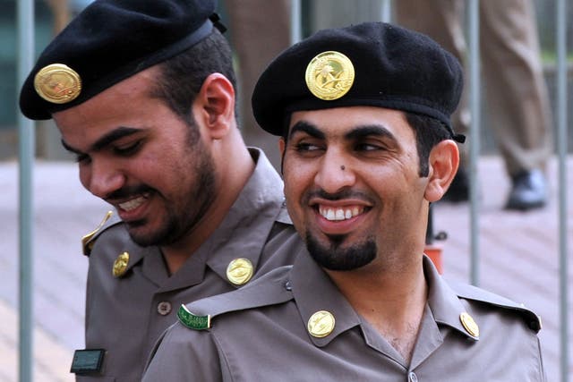 Saudi police officers guard the Public Grievances Department in Riyadh