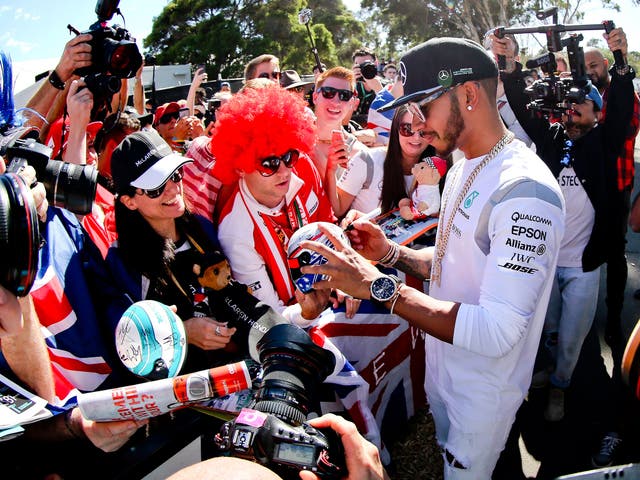 Lewis Hamilton signs autographs at the Albert Park circuit in Melbourne