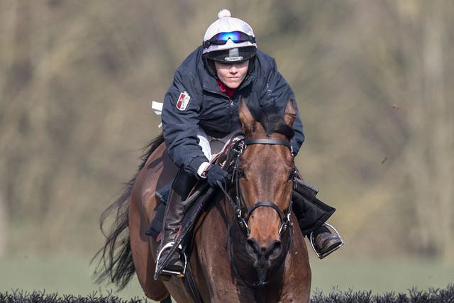 Victoria Pendleton on Minella Theatre clears a jump on the gallops at Aston Rowant in Oxfordshire