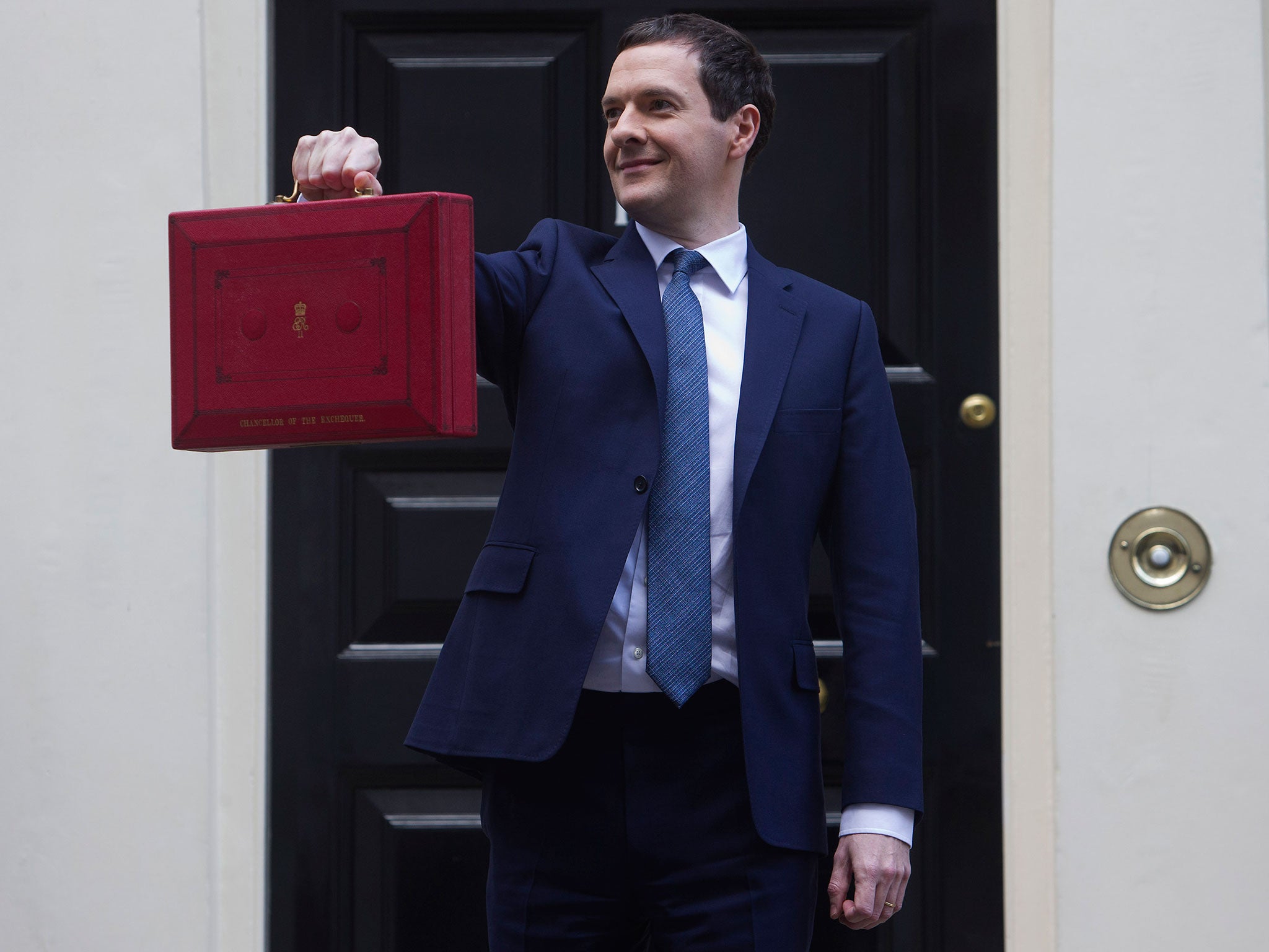 Finance Minister George Osborne poses for pictures with the Budget Box as he leaves 11 Downing Street in London