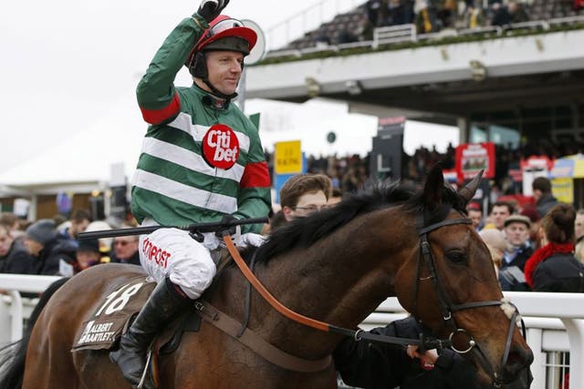 Noel Fehily celebrates on Unowhatimeanharry after riding to victory in the Novices' Hurdle