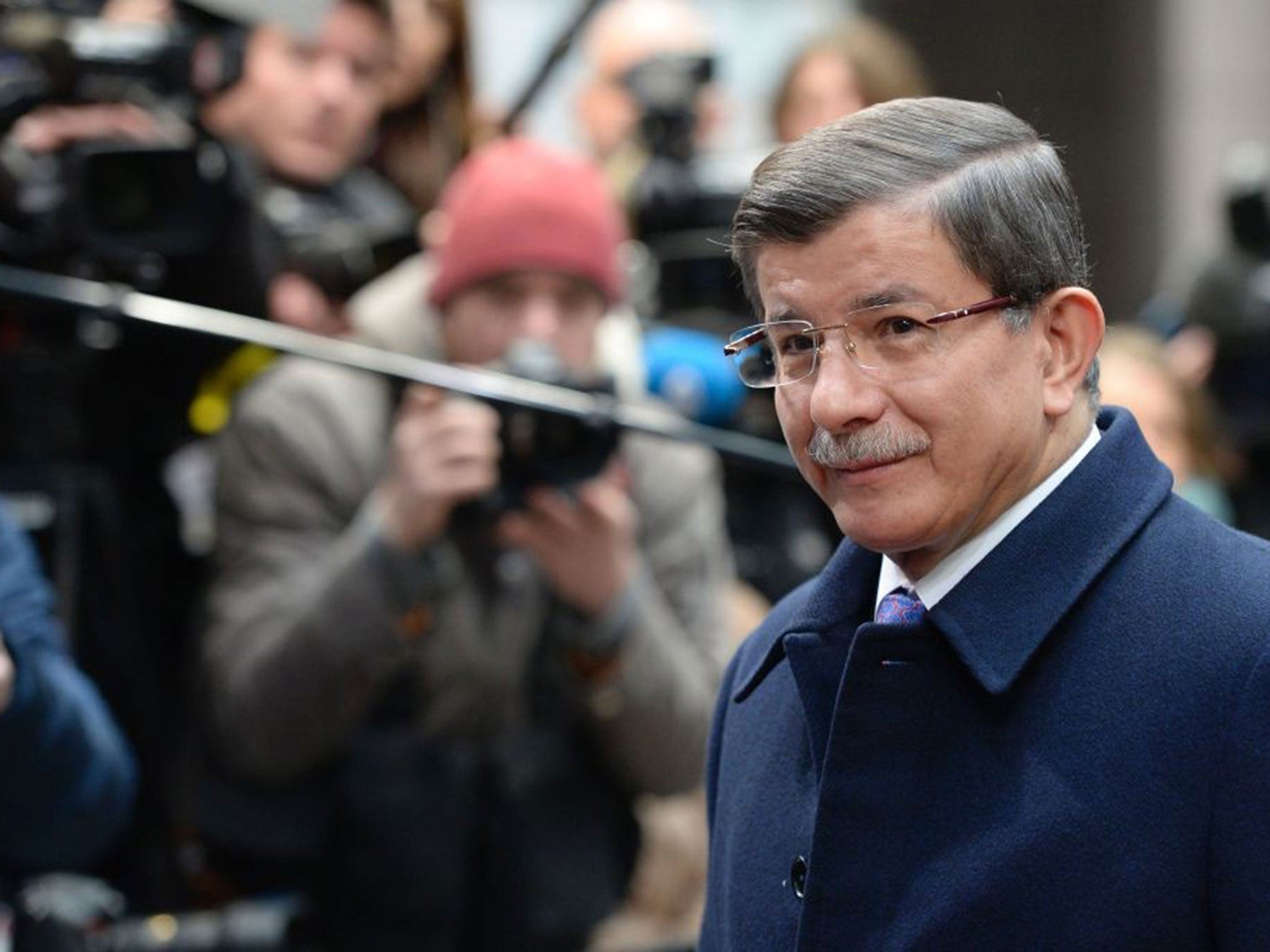 Turkish Prime Minister Ahmet Davutoglu arrives on the second day of the European Union summit to discuss the ongoing refugee crisis, in Brussels on March 18, 2016.