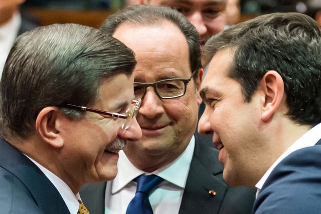 Ahmet Davutoglu, Francois Hollande and Alexis Tsipras at the Brussels summit