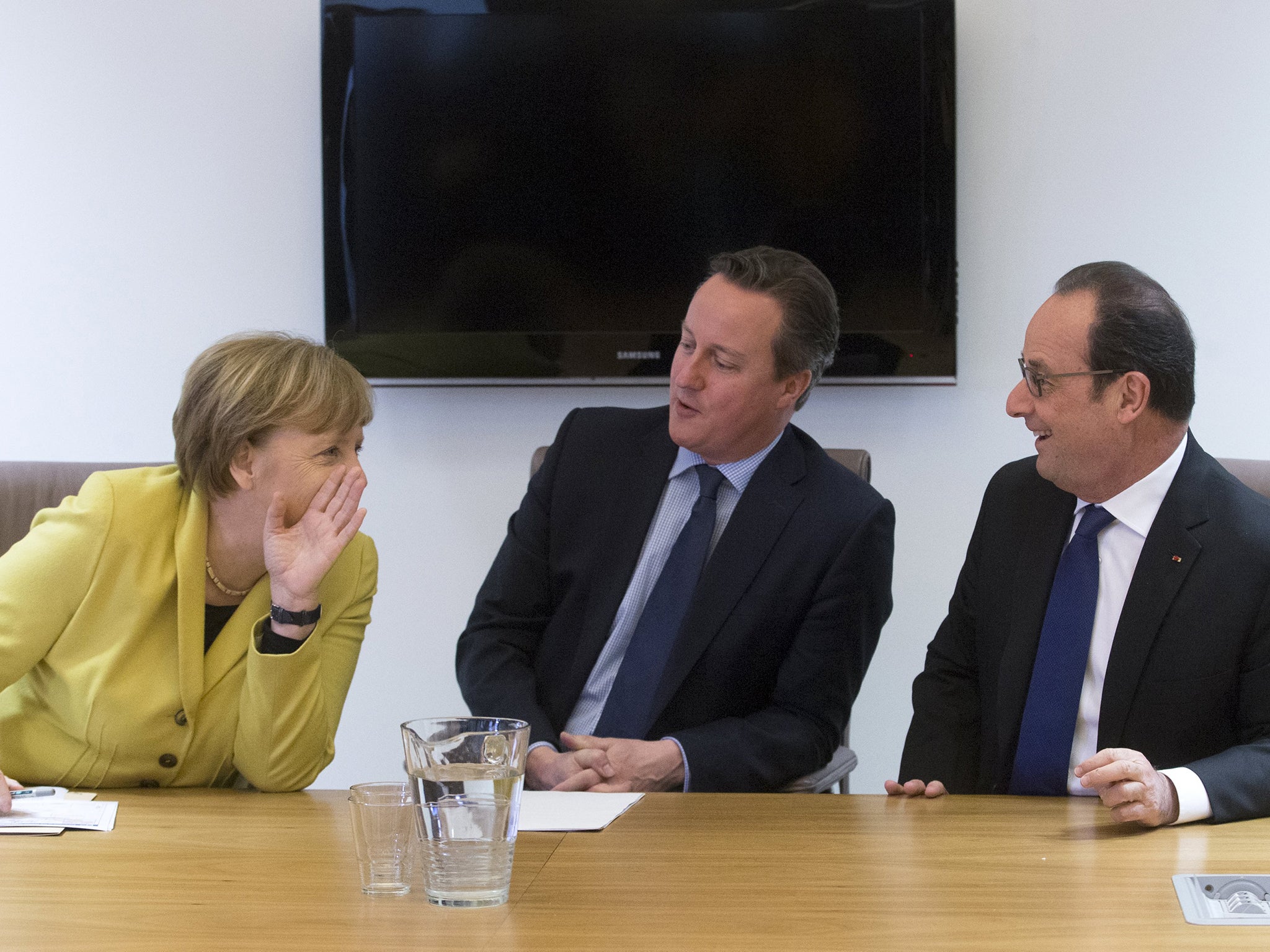 Germany's Chancellor Angela Merkel, Britain's Prime Minister David Cameron and France's President Francois Hollande attend a meeting during a European Union leaders summit on migration in Brussels, Belgium
