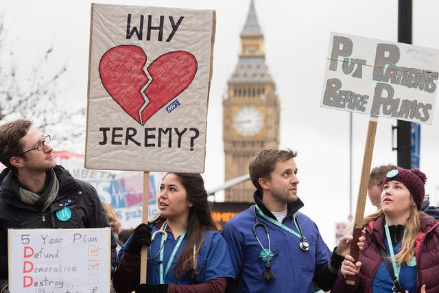 Junior doctors protest with banners outside St Thomas' Hospital in central London