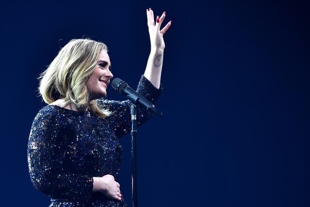 Adele performs on stage at The O2 Arena