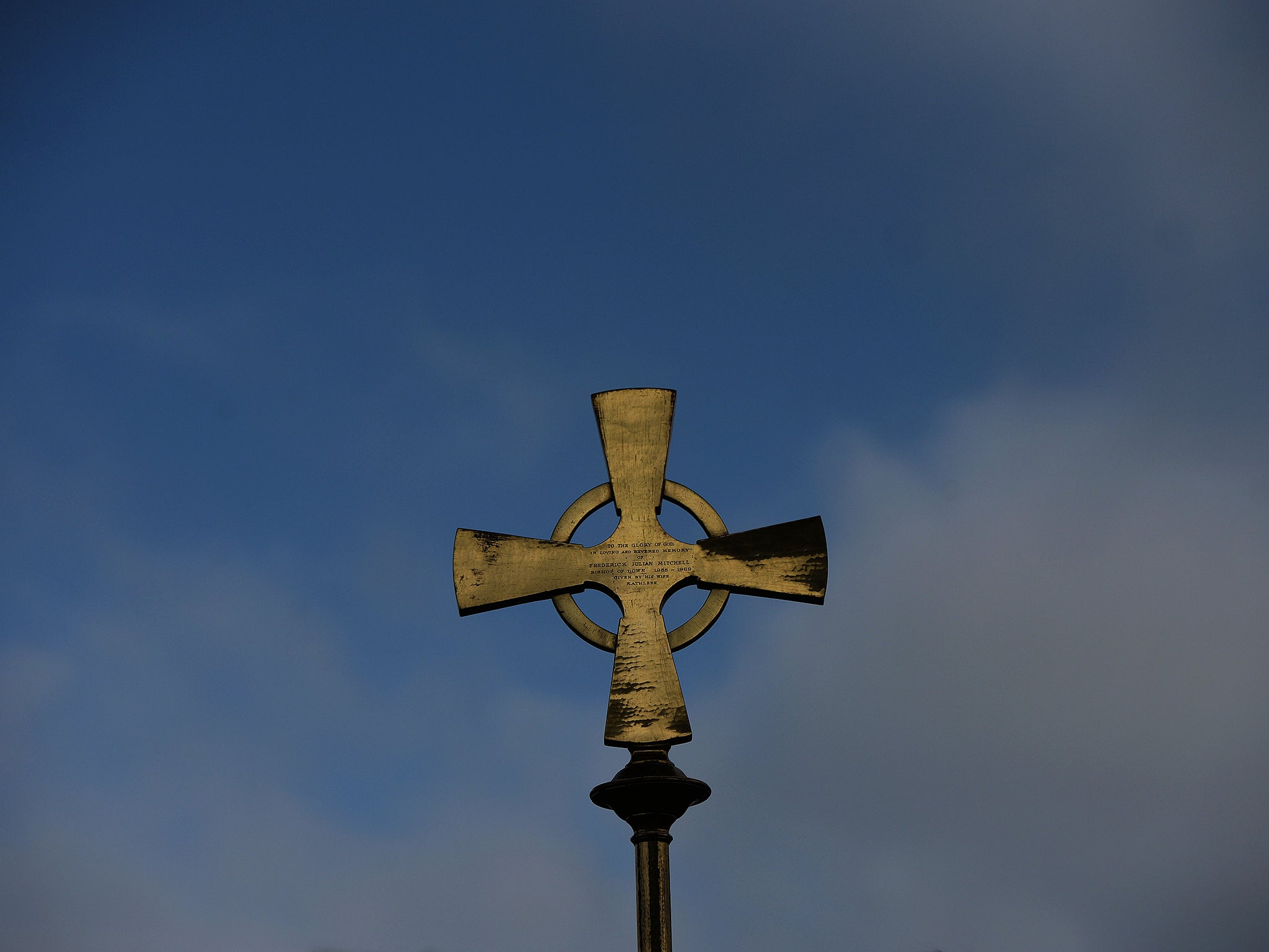 A gold cross and staff symbolising Saint Patrick can be seen during the annual Saint Patrick's Day service and pilgrimage from Saul church to Downpatrick cathedral