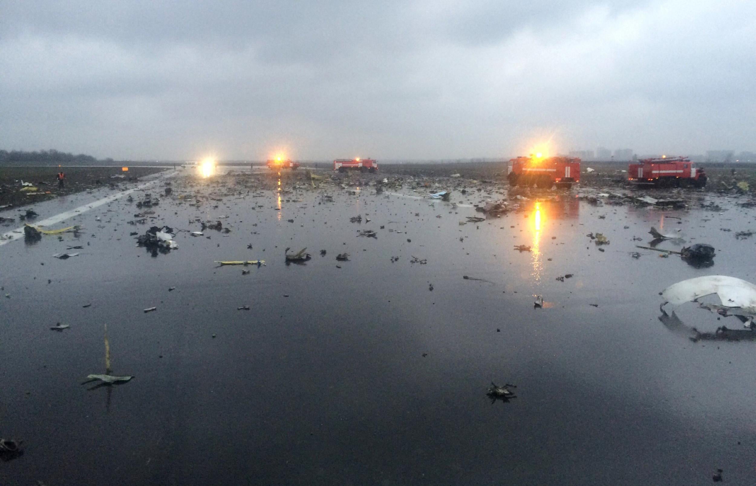 Russian emergency fire trucks are seen among the wreckage of a crashed plane at the Rostov-on-Don airport