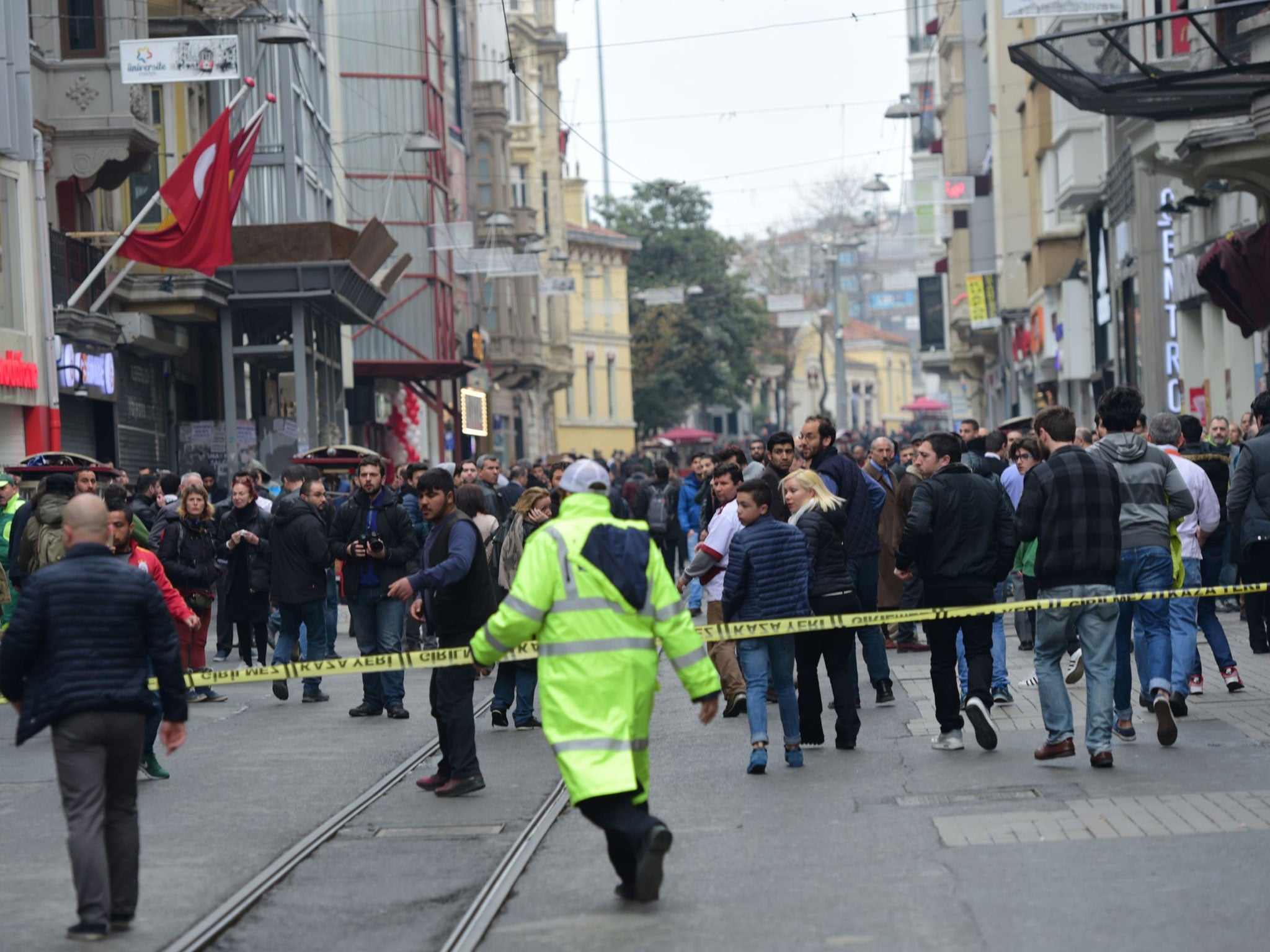 Turkish police push people away after an explosion on the pedestrian Istiklal Avenue in Istanbul on March 19, 2016.