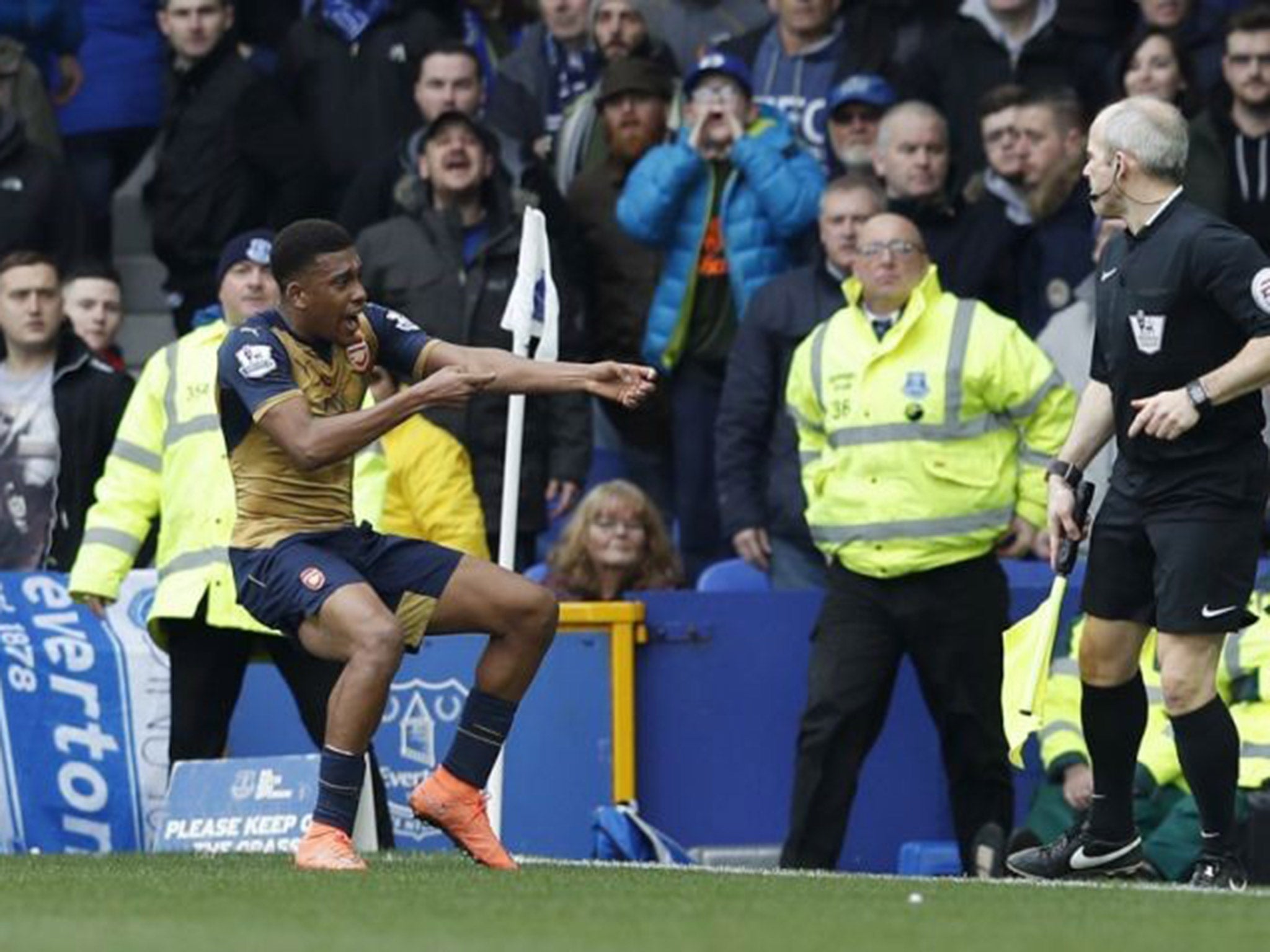 Arsenal forward Alex Iwobi celebrates after doubling the lead over Everton