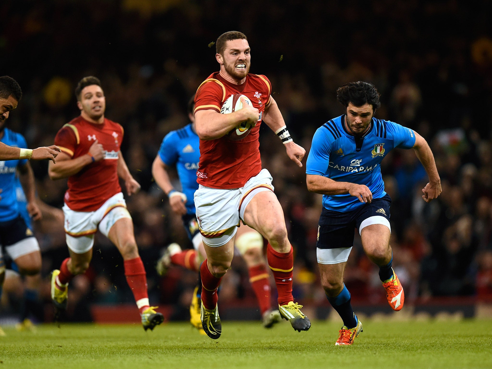 George North bursts through the Italy defence to score a try
