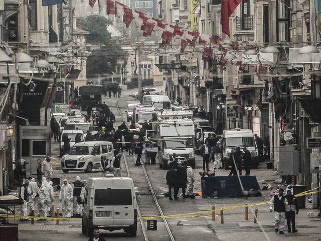 Emergency services inspect the area following a suicide bombing in a major shopping and tourist district in the central part of the city on March 19, 2016 in Istanbul, Turkey