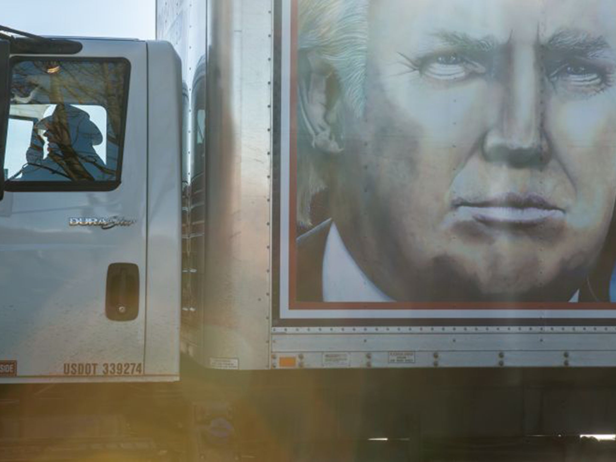 Driver Kraig Moss, on his CB radio, advertises a ‘Truckers for Trump’ convoy in Iowa
