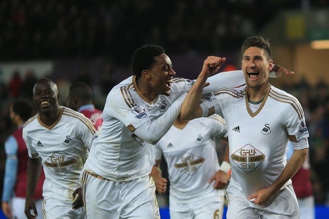 Swansea City defender Federico Fernandez celebrates his goal