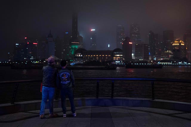 The Shanghai skyline descends into darkness during Earth Hour last year