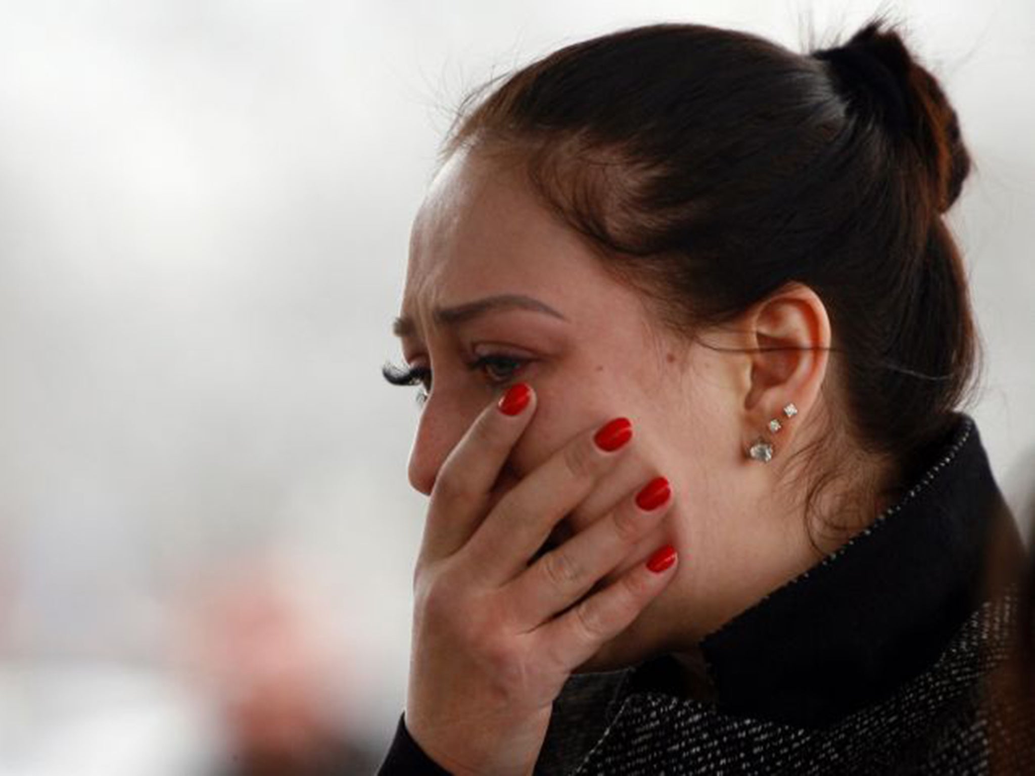 &#13;
A mourner at Rostov-on-Don airport, the scene of the crash &#13;