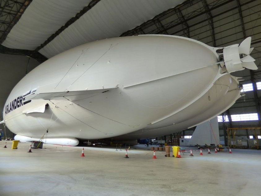The Airlander 10 - part plane, part airship and part helicopter - in all its 302ft (92m) long glory in a First World War aircraft hangar in Bedfordshire