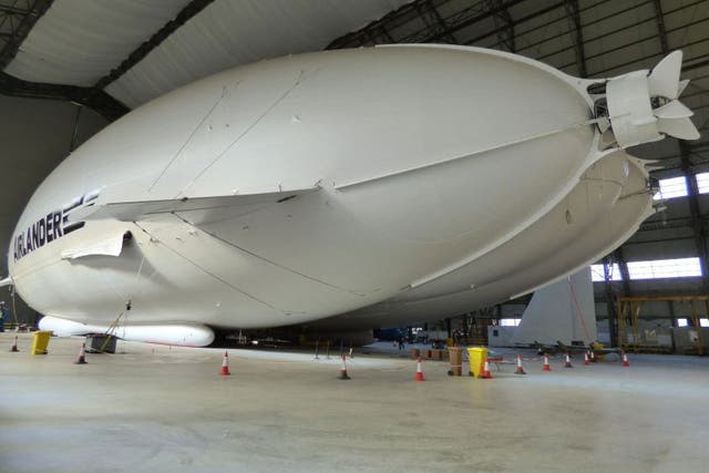The Airlander 10 - part plane, part airship and part helicopter - in all its 302ft (92m) long glory in a First World War aircraft hangar in Bedfordshire
