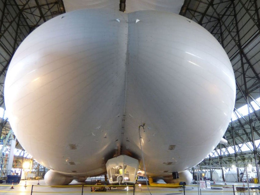 The Airlander 10 - part plane, part airship and part helicopter - in all its 302ft (92m) long glory in a First World War aircraft hangar in Bedfordshire