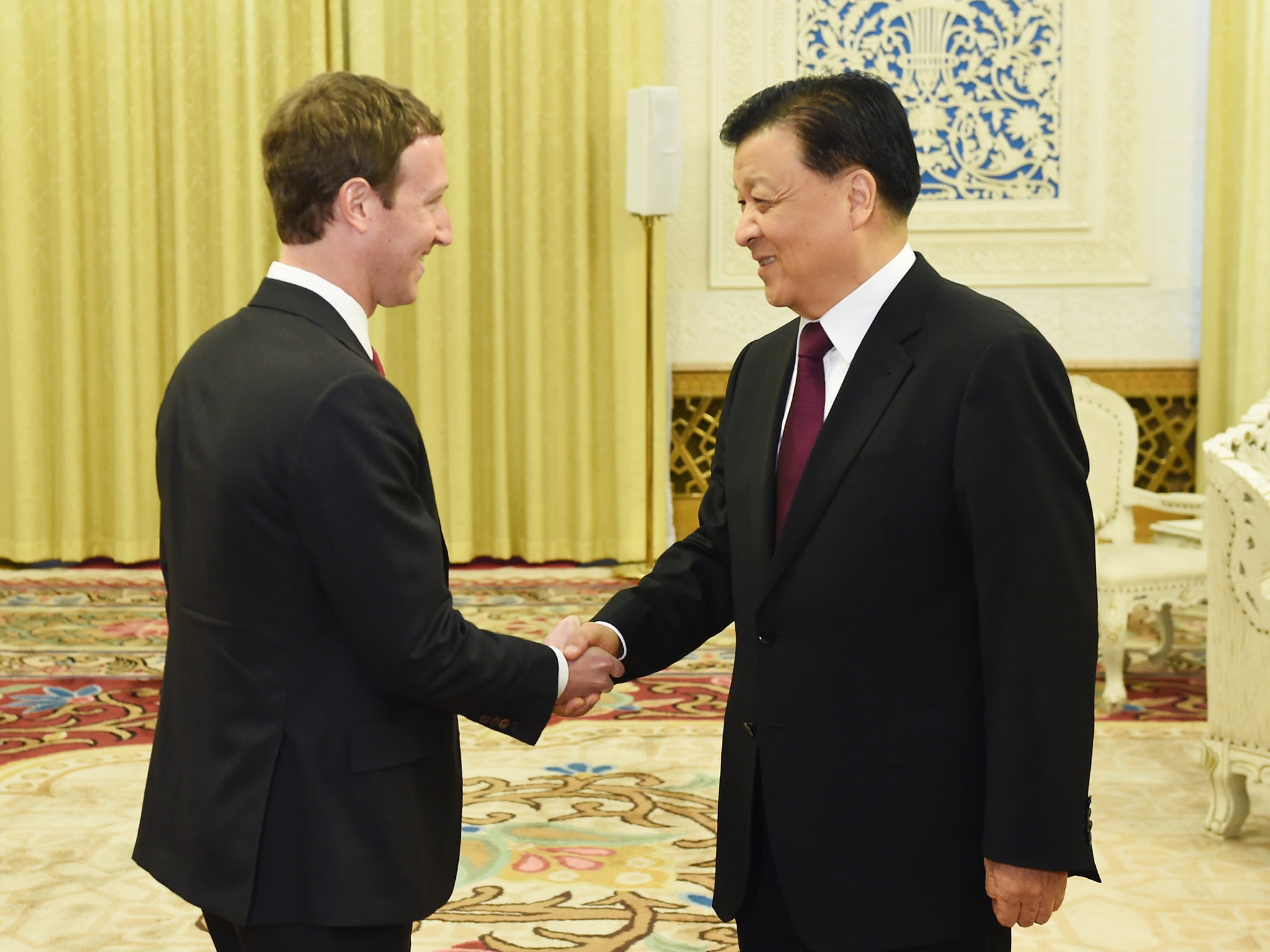 Mark Zuckerberg shakes hands with Liu Yunshan, China's propaganda minister