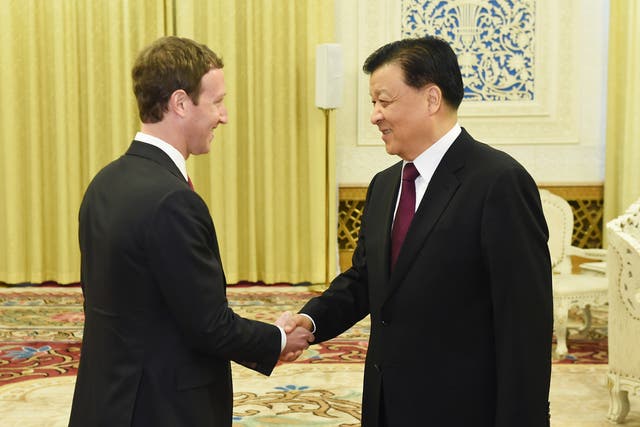 Mark Zuckerberg shakes hands with Liu Yunshan