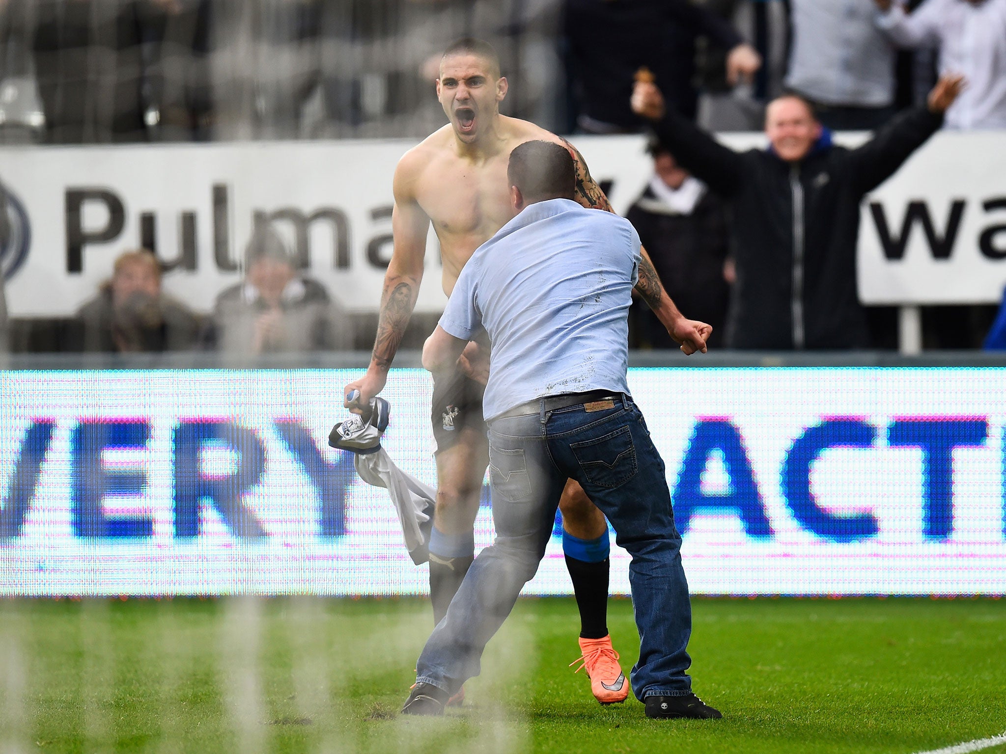 Mitrovic and the fan go to embrace