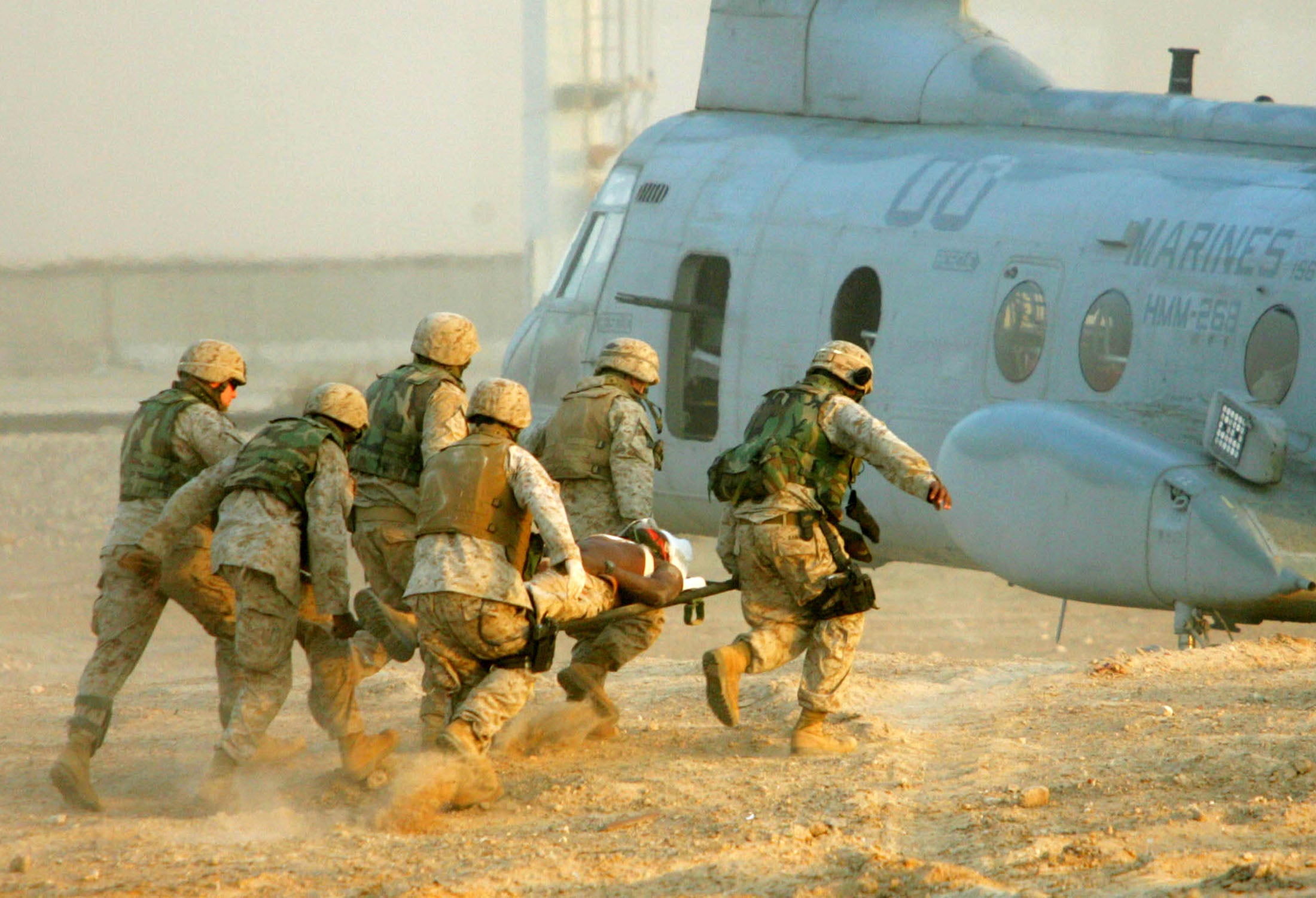 US Marines carry an injured colleague in Iraq
