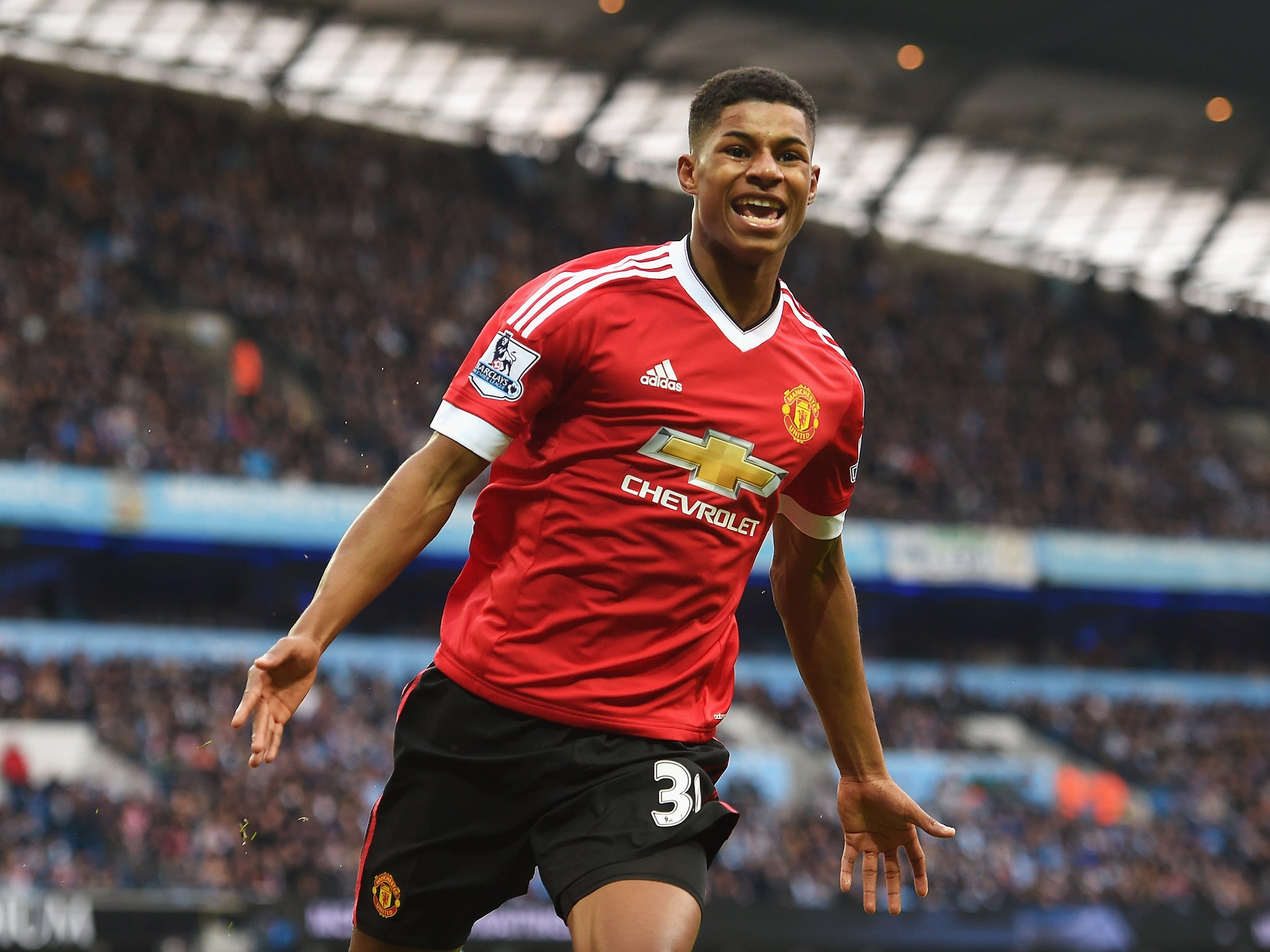 Marcus Rashford celebrates after opening the scoring