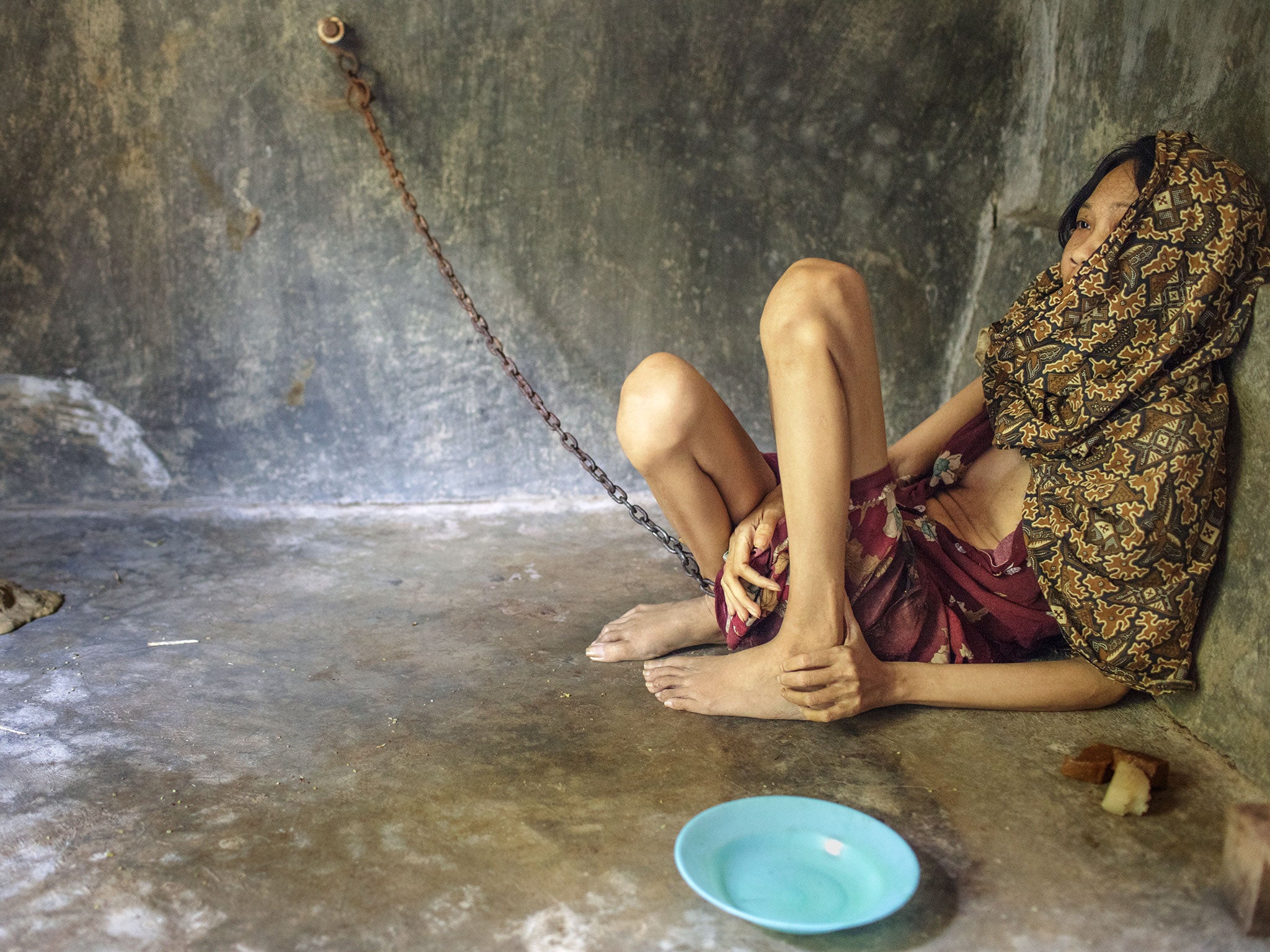 A woman left chained in a room in East Java