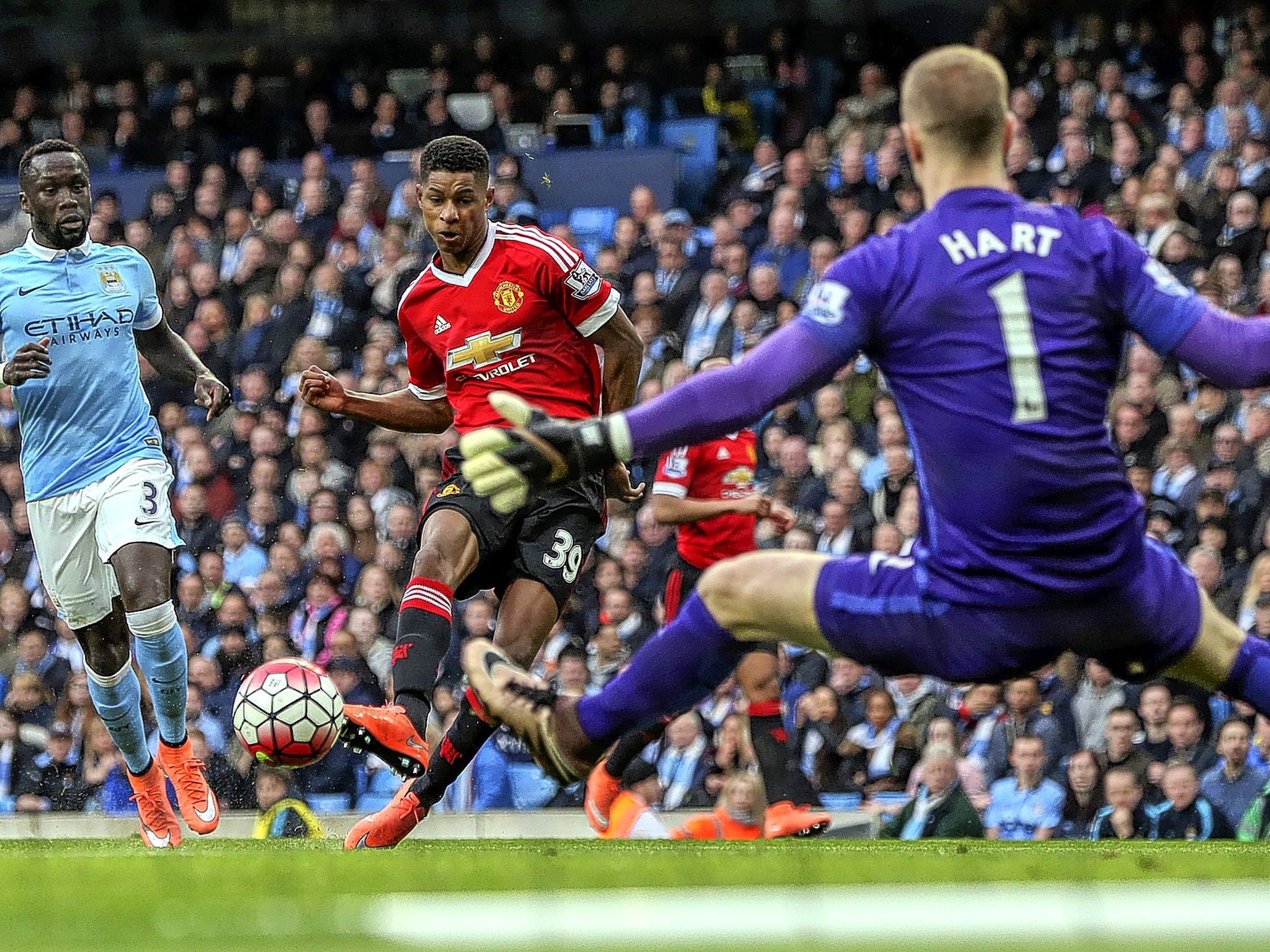 Marcus Rashford pokes the ball beyond the reach of Joe Hart for Manchester United’s winner