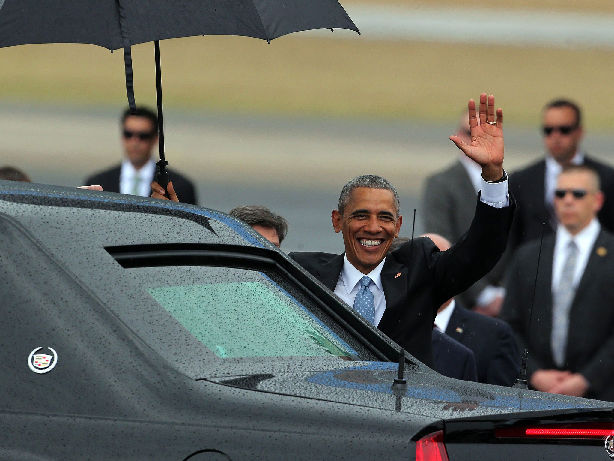 US President Barack Obama waves after his arrival on Jose Marti Airport in Havana, Cuba