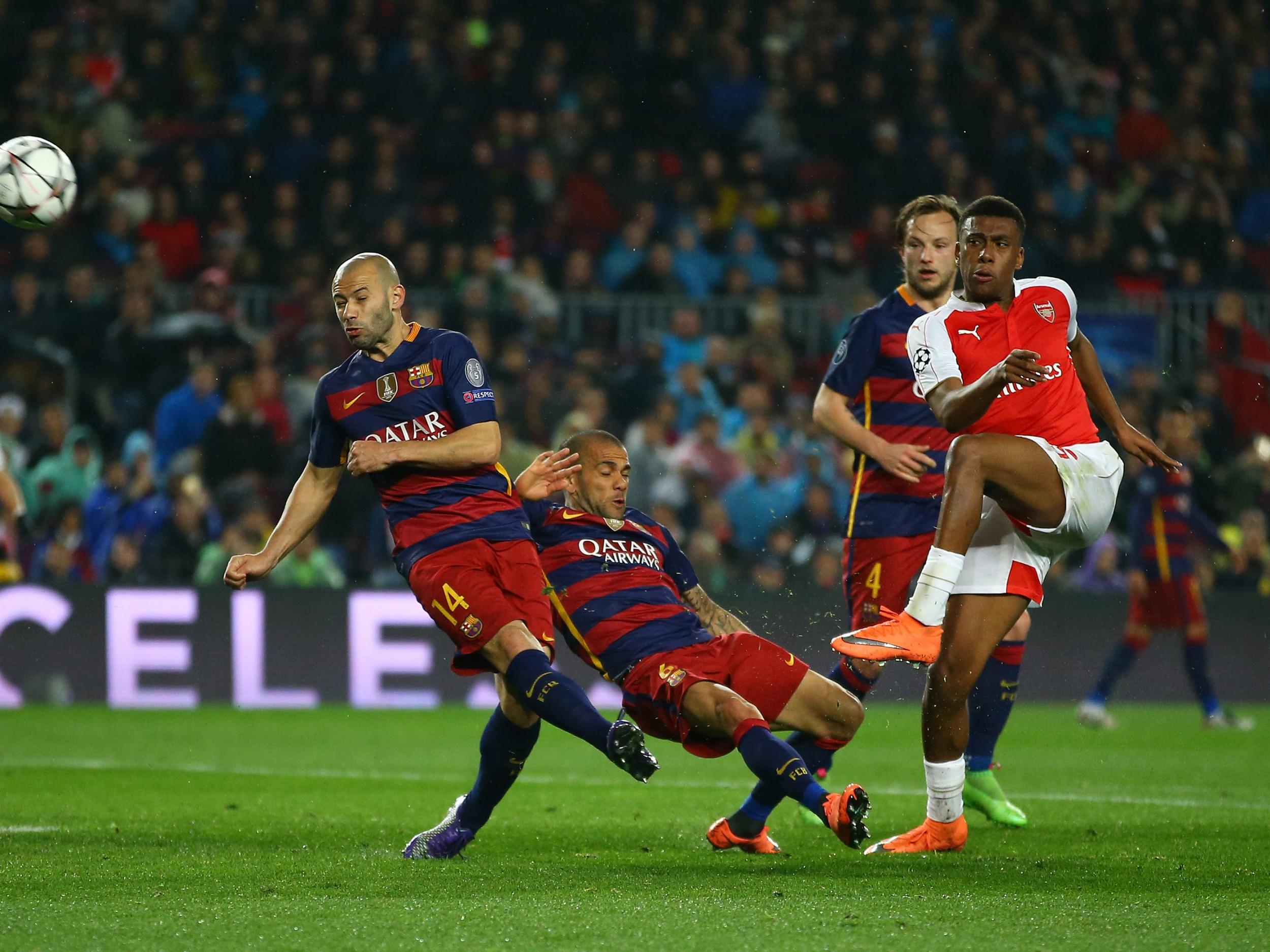 Alex Iwobi in action against Barcelona in the Champions League