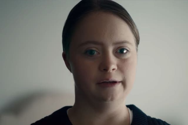 A young woman with Down Sydrome appears in the charity's video