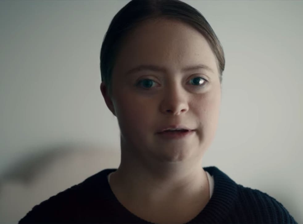 A young woman with Down Sydrome appears in the charity's video