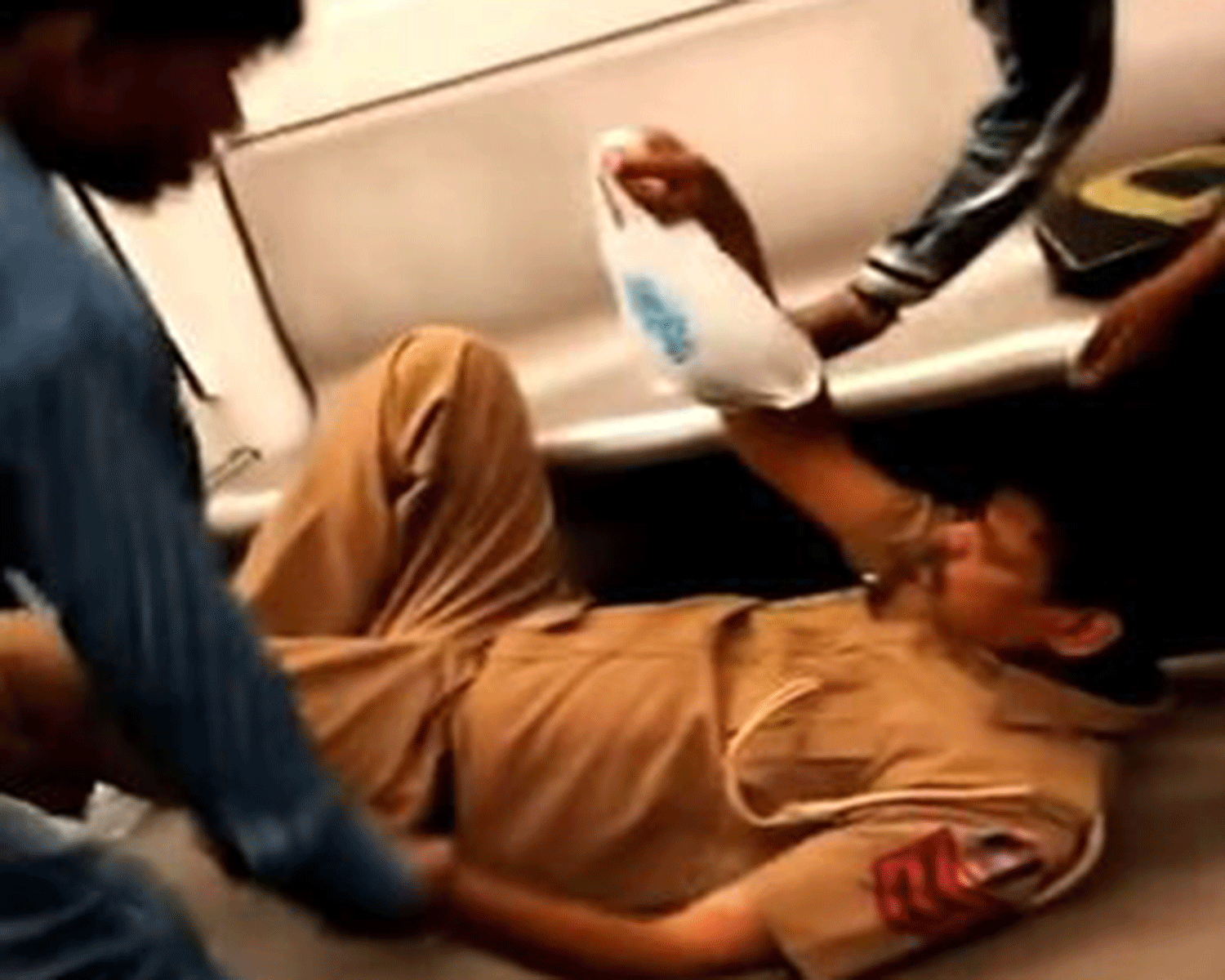 The video, entitled "Drunk Delhi policeman on Delhi metro - FUNNY" shows the policeman falling to the ground due to a stroke