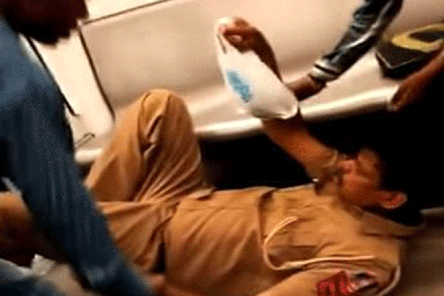 The video, entitled "Drunk Delhi policeman on Delhi metro - FUNNY" shows the policeman falling to the ground due to a stroke