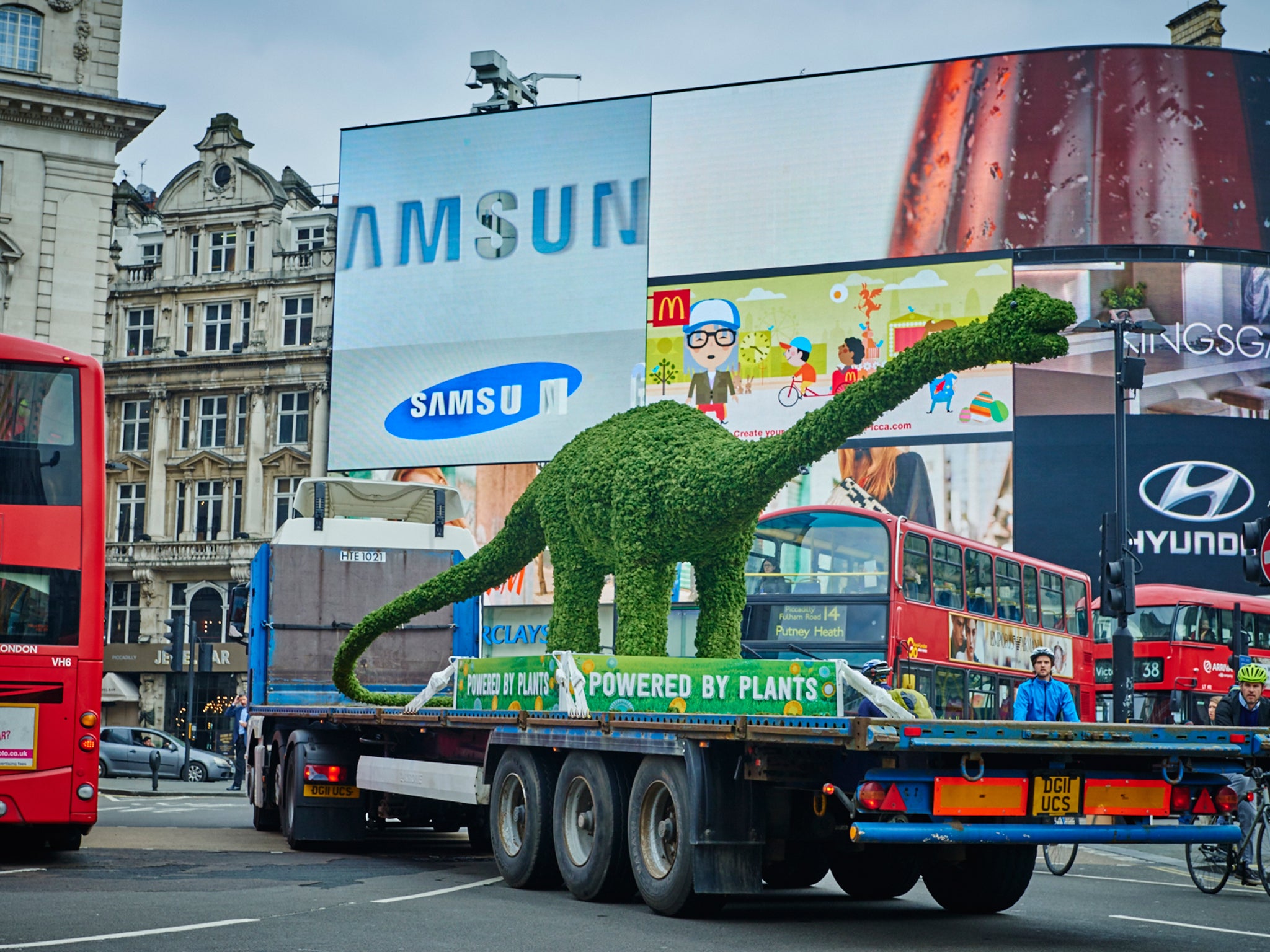 Florasaurus, the giant diplodocus made of plants roams through Central London, as Flora launches a programme of activities to connect children and families with where their food comes from