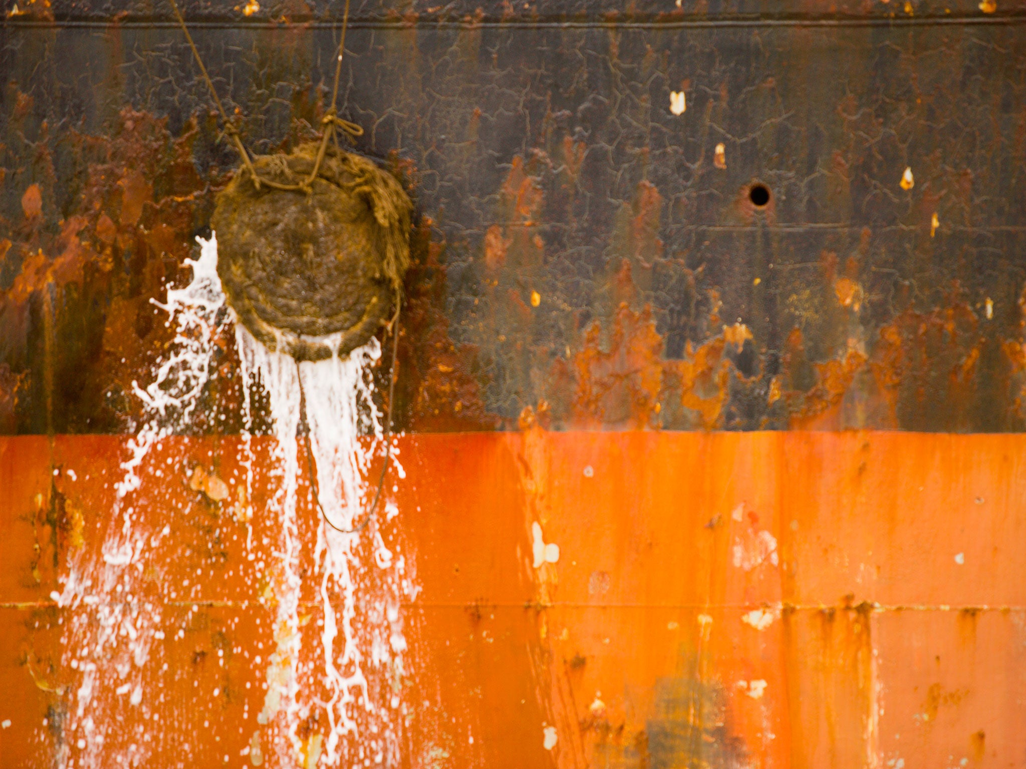 Waste water pours from a ship in Patagonia. The recent boom in passenger and crew numbers, coupled with sanitation problems, is incubating communicable diseases