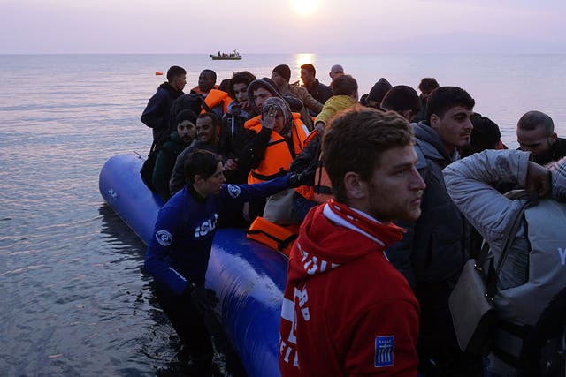 Refugees and migrants arrive on the Greek island of Lesbos on Monday